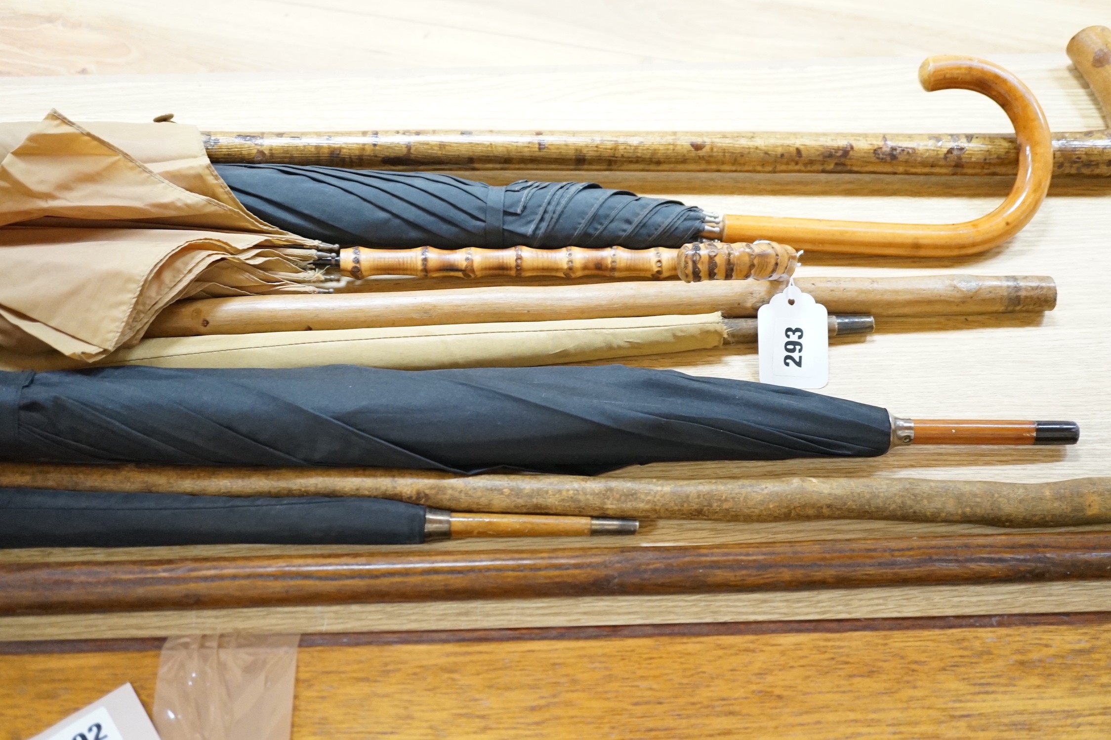 Four umbrellas and four walking sticks
